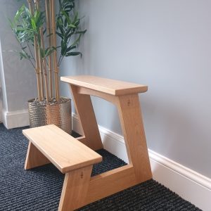 Handmade Dagaz step stool beside a desk in a modern office