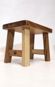 Traditional oak milking stool with sturdy solid wood construction