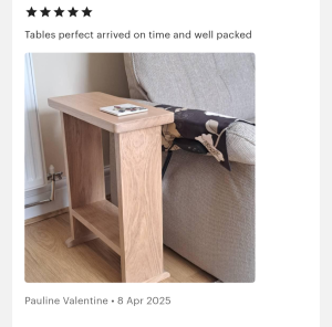 Solid oak side table beside a sofa in a living room