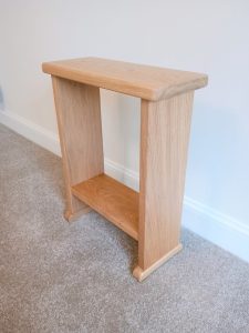 Natural oak side table with open shelf storage